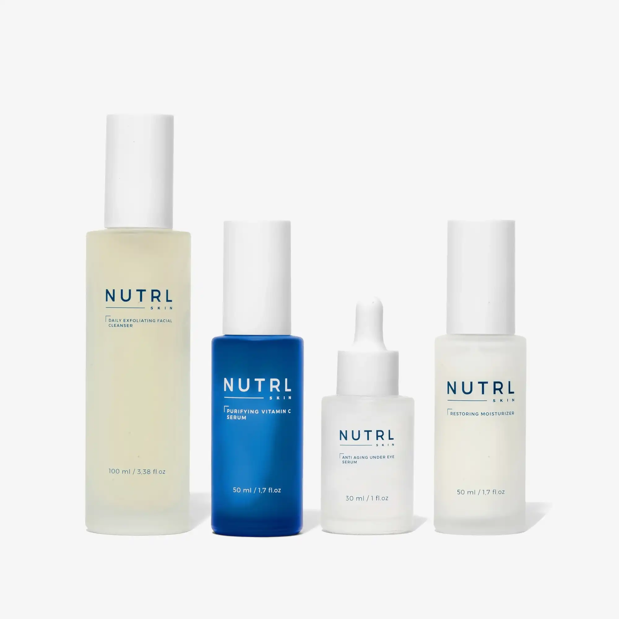 NUTRL Total Package - cleanser, vitamin C serum, under eye serum and moisturizer bottles